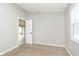 This bedroom features a neutral color scheme, soft carpet, and natural light from the window at 1946 N Riley Ave, Indianapolis, IN 46218
