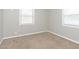 This is a bedroom with neutral paint, windows, blinds, and carpeted floors at 1946 N Riley Ave, Indianapolis, IN 46218