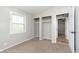This bedroom features a double door closet, neutral color scheme, soft carpet, and natural light at 1946 N Riley Ave, Indianapolis, IN 46218