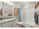 Well-lit bathroom with a single vanity, tub/shower combo, and neutral wall decor at 1972 Mobley Dr, Westfield, IN 46074