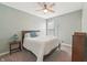 Cozy bedroom with light walls, plush carpet, ceiling fan, and a comfortable queen-sized bed at 1972 Mobley Dr, Westfield, IN 46074