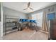 Spacious room with multiple monitors, shelving, and a large window offering natural light at 1972 Mobley Dr, Westfield, IN 46074