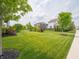 A quiet neighborhood street showcasing manicured lawns and diverse home styles at 1972 Mobley Dr, Westfield, IN 46074