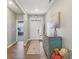 Inviting foyer with hardwood floors, stylish console table, and access to home office at 1972 Mobley Dr, Westfield, IN 46074