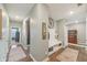 Hallway featuring neutral decor, rugs, and a bench with coat hooks at 1972 Mobley Dr, Westfield, IN 46074