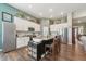 Modern kitchen boasts white cabinets, stainless steel appliances, and a functional center island at 1972 Mobley Dr, Westfield, IN 46074