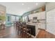Spacious kitchen features a large island, stainless steel appliances, and wood floors at 1972 Mobley Dr, Westfield, IN 46074