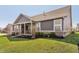 Single-story home featuring a covered patio and landscaped yard, ideal for outdoor enjoyment at 1972 Mobley Dr, Westfield, IN 46074