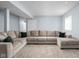 Spacious finished basement featuring plush carpeting, a large sectional sofa, and a light, neutral color scheme at 2043 Winthrop Ave, Indianapolis, IN 46202