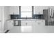 Sleek kitchen with modern backsplash, stainless steel appliances, and plenty of counter space at 2043 Winthrop Ave, Indianapolis, IN 46202