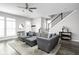 Open-concept living room is spacious with lots of light and sleek, modern furnishings at 2043 Winthrop Ave, Indianapolis, IN 46202