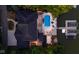 Aerial night view of a gorgeous lakefront home with boat docks, pool, seating and lush landscaping at 219 Surrey Hill, Noblesville, IN 46062