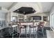 Stylish bar area featuring ample counter space, seating, and sleek black tile flooring at 219 Surrey Hill, Noblesville, IN 46062