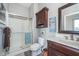 Functional bathroom with a shower, wooden vanity, and decor with an ocean theme at 219 Surrey Hill, Noblesville, IN 46062