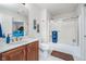Well-lit bathroom with a shower/tub combo, a wooden vanity, and a neutral color palette at 219 Surrey Hill, Noblesville, IN 46062