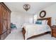 Bedroom with hardwood furniture, a comfortable chair and plenty of natural light at 219 Surrey Hill, Noblesville, IN 46062