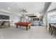 Spacious game room boasts a pool table, bar area with seating, and ample space for entertaining at 219 Surrey Hill, Noblesville, IN 46062