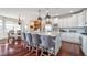 Spacious kitchen with a large island, pendant lighting, and a view into the adjacent dining area at 219 Surrey Hill, Noblesville, IN 46062