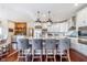 Modern kitchen featuring a large center island with seating, stainless steel appliances, and custom cabinetry at 219 Surrey Hill, Noblesville, IN 46062