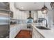 Well-appointed kitchen with stainless steel appliances, granite countertops, and custom white cabinetry at 219 Surrey Hill, Noblesville, IN 46062