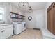 Convenient laundry room with modern appliances, ample storage, and stylish design elements at 219 Surrey Hill, Noblesville, IN 46062