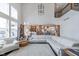 Spacious living room with an open floor plan, high ceilings, white furniture, and a glimpse into the kitchen and dining area at 219 Surrey Hill, Noblesville, IN 46062