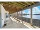 Spacious covered patio offering water views, providing a relaxing outdoor living space at 219 Surrey Hill, Noblesville, IN 46062