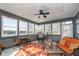 Light-filled sunroom with panoramic views of the lake, creating a relaxing retreat at 219 Surrey Hill, Noblesville, IN 46062