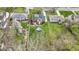Aerial shot of a home shows an above-ground pool, a back patio, and a large backyard at 2210 Douglas Rd, Indianapolis, IN 46220