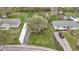 An aerial view showcasing the property, its landscaping, and the surrounding neighborhood at 2210 Douglas Rd, Indianapolis, IN 46220