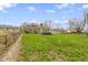 Large backyard shows a grassy area with a fenced perimeter and an above-ground pool at 2210 Douglas Rd, Indianapolis, IN 46220