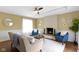 Bright living room featuring a fireplace, and neutral decor at 2210 Douglas Rd, Indianapolis, IN 46220