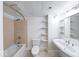 Full bathroom with shower-tub combo, toilet, sink, and storage at 230 E 9Th St # 502, Indianapolis, IN 46204