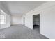 Spacious bedroom with neutral carpet, ample natural light, and closet at 230 E 9Th St # 502, Indianapolis, IN 46204