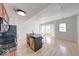 Modern kitchen with island, stainless steel appliances, and light hardwood floors at 230 E 9Th St # 502, Indianapolis, IN 46204