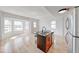 Open kitchen with island seating and stainless refrigerator, perfect for entertaining at 230 E 9Th St # 502, Indianapolis, IN 46204