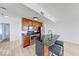 Modern kitchen featuring stainless steel appliances, a granite island, and ample storage space at 230 E 9Th St # 502, Indianapolis, IN 46204