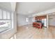 Sun-filled living space with hardwood floors and a modern kitchen island at 230 E 9Th St # 502, Indianapolis, IN 46204