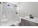 Updated bathroom features a new shower surround, modern fixtures, and a sleek vanity at 241 N Tacoma Ave, Indianapolis, IN 46201