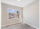 This bedroom features wood-look flooring and neutral walls with natural light at 241 N Tacoma Ave, Indianapolis, IN 46201