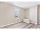 This bedroom features wood floors, a window for natural light, and a built-in bench seat at 241 N Tacoma Ave, Indianapolis, IN 46201