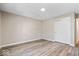 Well-lit bedroom featuring neutral walls, modern flooring, and a double-door closet at 241 N Tacoma Ave, Indianapolis, IN 46201