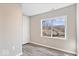 This bedroom features wood-look flooring and neutral walls with natural light and closet at 241 N Tacoma Ave, Indianapolis, IN 46201
