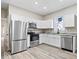 New kitchen with stainless steel appliances, gray countertops and white cabinets at 241 N Tacoma Ave, Indianapolis, IN 46201