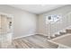 Inviting living room featuring contemporary flooring and a staircase with white rails at 241 N Tacoma Ave, Indianapolis, IN 46201