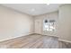 Bright living room with modern floors and a large window for natural light at 241 N Tacoma Ave, Indianapolis, IN 46201