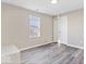 Well-lit bedroom with hardwood floors, closet and a window at 243 N Tacoma Ave, Indianapolis, IN 46201