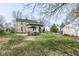 Backyard featuring a patio with outdoor dining, a grill, and a well-maintained lawn, great for gatherings at 25 W 59Th St, Indianapolis, IN 46208
