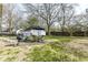 Backyard featuring a patio with outdoor dining, a grill, and a spacious lawn perfect for entertaining at 25 W 59Th St, Indianapolis, IN 46208
