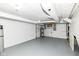 Unfinished basement featuring painted brick walls, a water softener, and concrete floors at 25 W 59Th St, Indianapolis, IN 46208
